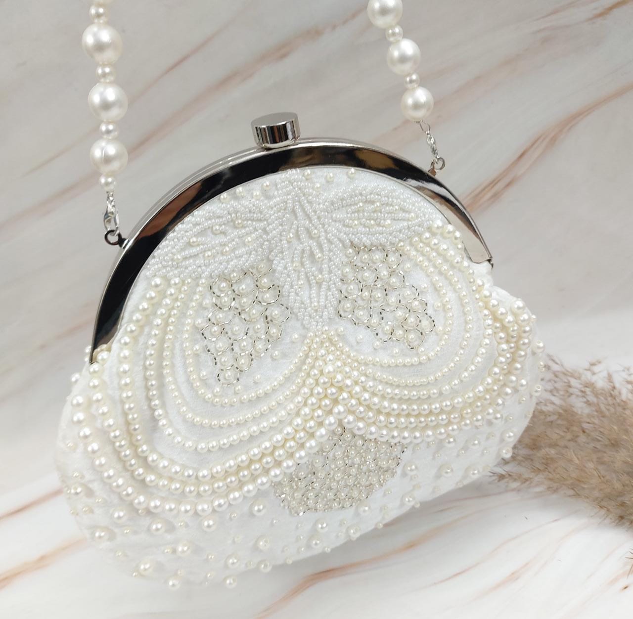 Rishika embroidered pearl clutch